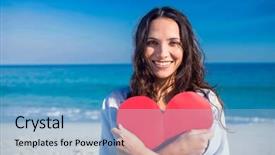  Presentation with heart - Audience pleasing slide deck consisting of smiling woman holding heart card at the beach on a sunny day backdrop and a light blue colored foreground