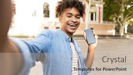  Presentation with outdoors - Colorful presentation theme enhanced with smiling young african man outdoors showing blank screen mobile phone taking a selfie backdrop and a soft green colored foreground