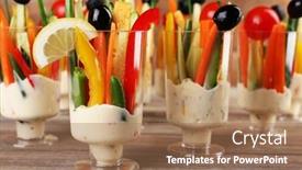  Presentation with glassware - Beautiful presentation featuring snack of vegetables in glassware on wooden table closeup backdrop and a coral colored foreground