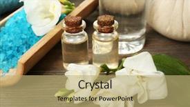  Presentation with table salt - Presentation theme enhanced with spa composition with sea salt in a bowl aroma oil and flowers on wooden table close up background and a coral colored foreground