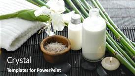 Presentation with bamboo flower - Presentation having spa setting on mat with bamboo grove oil candle white flower on towel background and a dark gray colored foreground