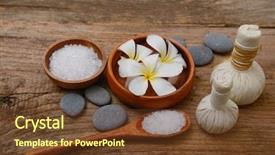  Presentation with old wood - Theme consisting of spa setting with salt in spoon oil frangipani on old wood background and a tawny brown colored foreground