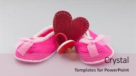  Presentation with baby shoes - Slide set with space knitted baby booties crochet background and a coral colored foreground