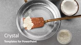  Presentation with coconut oil - Amazing PPT theme having spatula with coconut oil backdrop and a gray colored foreground