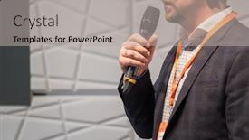  Presentation with speaker - Theme having speaker at conference holding microphone in the hand background and a light gray colored foreground