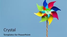  Presentation with pinwheel - PPT theme consisting of purple spiral - colorful pinwheel isolated on blue background and a light blue colored foreground