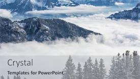 Presentation with alpine - Amazing PPT theme having splendid winter alpine scenery with high mountains and trees covered with snow clouds hanging low in the valley backdrop and a light gray colored foreground