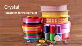  Presentation with thread - Cool new theme with spools of color ribbon thread and buttons on wooden background backdrop and a red colored foreground