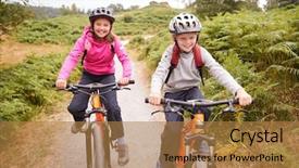  Presentation with mountain view - Audience pleasing presentation theme consisting of spring time mountains - two children riding mountain bikes backdrop and a coral colored foreground