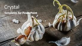  Presentation with garlic - Presentation design with sprouting-garlic-on-wooden-table background and a dark gray colored foreground