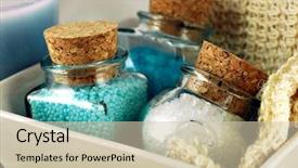  Presentation with crystals - Presentation theme consisting of still life of three bottles of bath crystals and a natural fiber cloth background and a soft green colored foreground