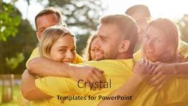  Presentation with teambuilding - Audience pleasing PPT theme consisting of successful young team hugs each other happily at the teambuilding workshop backdrop and a gold colored foreground