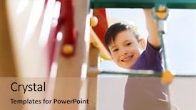  Presentation with children climbing - PPT theme featuring summer childhood leisure and people concept - happy little boy on children playground climbing frame background and a coral colored foreground