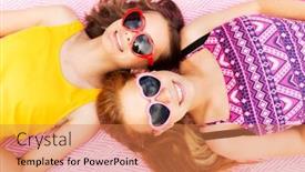  Presentation with valentines - Theme featuring summer fashion leisure and valentines day concept - smiling teenage girls in heart shaped sunglasses lying on picnic blanket background and a coral colored foreground