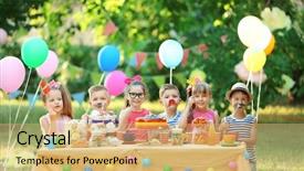 Presentation with children birthday - Slide set enhanced with summer party - children celebrating birthday in park background and a yellow colored foreground