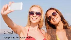  Presentation with women making - Beautiful presentation theme featuring summer vacation holidays travel technology and people concept - two smiling young women on beach making selfie with smartphone over blue sky background backdrop and a coral colored foreground