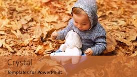  Presentation with dry forest - Beautiful PPT theme featuring sweet baby boy having fun in autumn park sitting on the ground covered with dry leaves in the forest little baby playing with his best friend soft toy rabbit happy carefree childhood backdrop and a red colored foreground