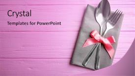  Presentation with table napkin - Beautiful presentation featuring table setting with silver cutlery and napkin on pink wooden background backdrop and a lavender colored foreground