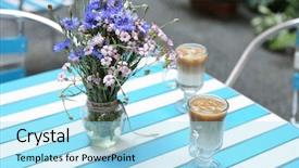  Presentation with noise - Presentation theme having table with fresh wild flowers and ice coffee in cafe image toned and noise added background and a light blue colored foreground
