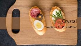  Presentation with wooden board empty table top - Presentation theme with tartin - open faced sandwich canape background and a coral colored foreground
