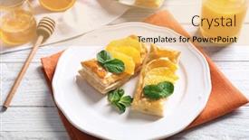  Presentation with puff pastry - Beautiful slide deck featuring tasty puff pastry dessert with orange and mint on served table backdrop and a yellow colored foreground