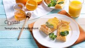  Presentation with puff pastry - Colorful slide set enhanced with tasty puff pastry dessert with orange and mint on served table backdrop and a yellow colored foreground