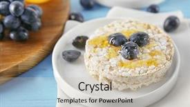  Presentation with wafers - Audience pleasing slide deck consisting of tasty rice wafers with grape and honey on blue wooden table backdrop and a soft green colored foreground