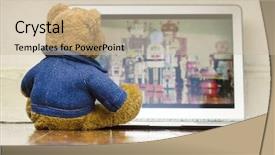  Presentation with film - Presentation theme with teddy bear watching a film on a laptop computer background and a soft green colored foreground