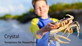  Presentation with crab - Slide set having teen age boy holding big crab at beach background and a teal colored foreground
