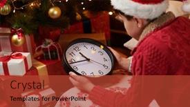  Presentation with christmas holidays - PPT theme featuring teen boy waiting for santa and watching the clock lying indoor near decorated xmas tree with lights dressed as santa helper - merry christmas and happy holidays background and a red colored foreground