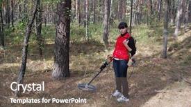  Presentation with metal detector - Amazing PPT theme having teen girl with metal detector backdrop and a gray colored foreground