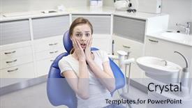 Presentation with dental office - PPT theme consisting of terrified patient girl at dental background and a light blue colored foreground