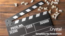  Presentation with popcorn - Amazing presentation theme having text edit - clapperboard and popcorn on wooden backdrop and a dark gray colored foreground