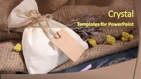  Presentation with textile - PPT theme having textile sachet pouch with dried flowers herbs on wooden table on sackcloth background background and a tawny brown colored foreground