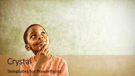  Presentation with foreign boy student - Audience pleasing PPT theme consisting of thoughtful boy standing against greenboard backdrop and a gold colored foreground