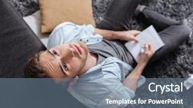  Presentation with carpet - Slides having top view of a thoughtful young man looking up and holding notepad while sitting on the carpet at home background and a seafoam green colored foreground