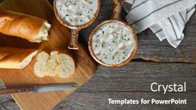  Presentation with clam - Slides having top view of two bowls of homemade clam chowder with fresh baked loaf of bread horizontal with copy space background and a dark gray colored foreground