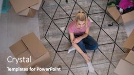  Presentation with new home - Audience pleasing PPT theme consisting of top view of young beautiful woman sitting and relaxing on the floor after moving into a new home with cardboard boxes around her backdrop and a gray colored foreground