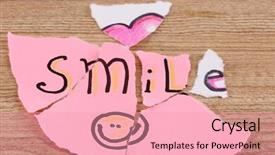  Presentation with torn paper - Slides having torn paper with words smile close-up on wooden table background and a coral colored foreground