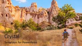  Presentation with cappadocia - PPT theme with tourist walking along cave rocks in cappadocia a historical region in central anatolia turkey background and a gold colored foreground