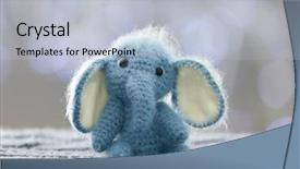  Presentation with knitted garments - Presentation theme with toy elephant on blurred background background and a light blue colored foreground