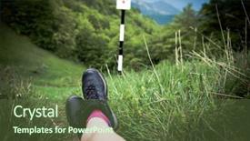  Presentation with trekking - Presentation theme enhanced with trekking break - woman's legs resting in green field above summer forest - focus on hiking boots background and a tawny brown colored foreground