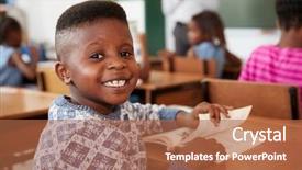  Presentation with school desk - PPT theme featuring turn - boy at desk smiling background and a  colored foreground