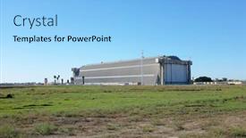  Presentation with building plans - Audience pleasing PPT theme consisting of tustin-blimp-hangar-building-28 backdrop and a light blue colored foreground
