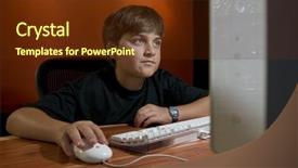  Presentation with monitor computer - PPT theme enhanced with tween boy working or playing in front of computer monitor background and a tawny brown colored foreground