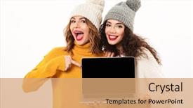  Presentation with laptop blank screen - PPT theme having two cheerful girls in sweaters background and a coral colored foreground