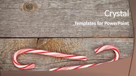  Presentation with cane - Presentation enhanced with two christmas candy cane over wooden background with copy space background and a gray colored foreground