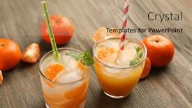  Presentation with mint - Colorful theme enhanced with two fresh delicious tangerine cocktails with ice mint straws and mandarins on the wooden table close up backdrop and a coral colored foreground