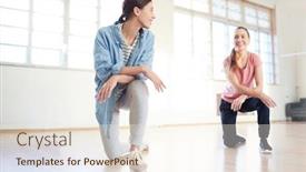  Presentation with knee - Slides with two friendly girls standing on one knee on the floor of studio and discussing new exercise during training background and a cream colored foreground