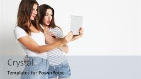  Presentation with selfie - PPT theme featuring two girls friends taking selfie with digital tablet background and a light blue colored foreground